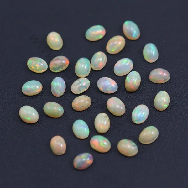 Ethiopian opal in cabochon, multicolored, in oval shape, 5 * 7mm x 1pc