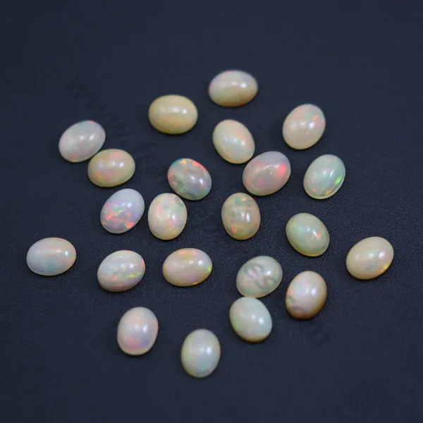 Cabochão de opala etíope, multicolorido, de forma oval 7x9mm x 1pc
