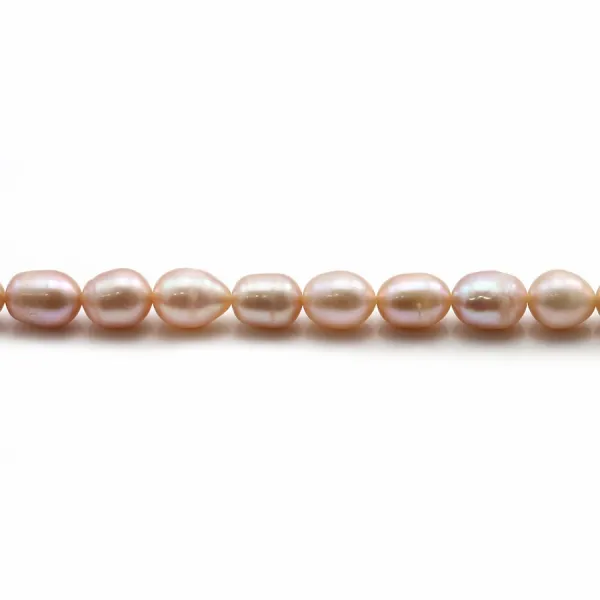 Perles d'eau douce ovales rosé sur fil 6-7mm x 40cm