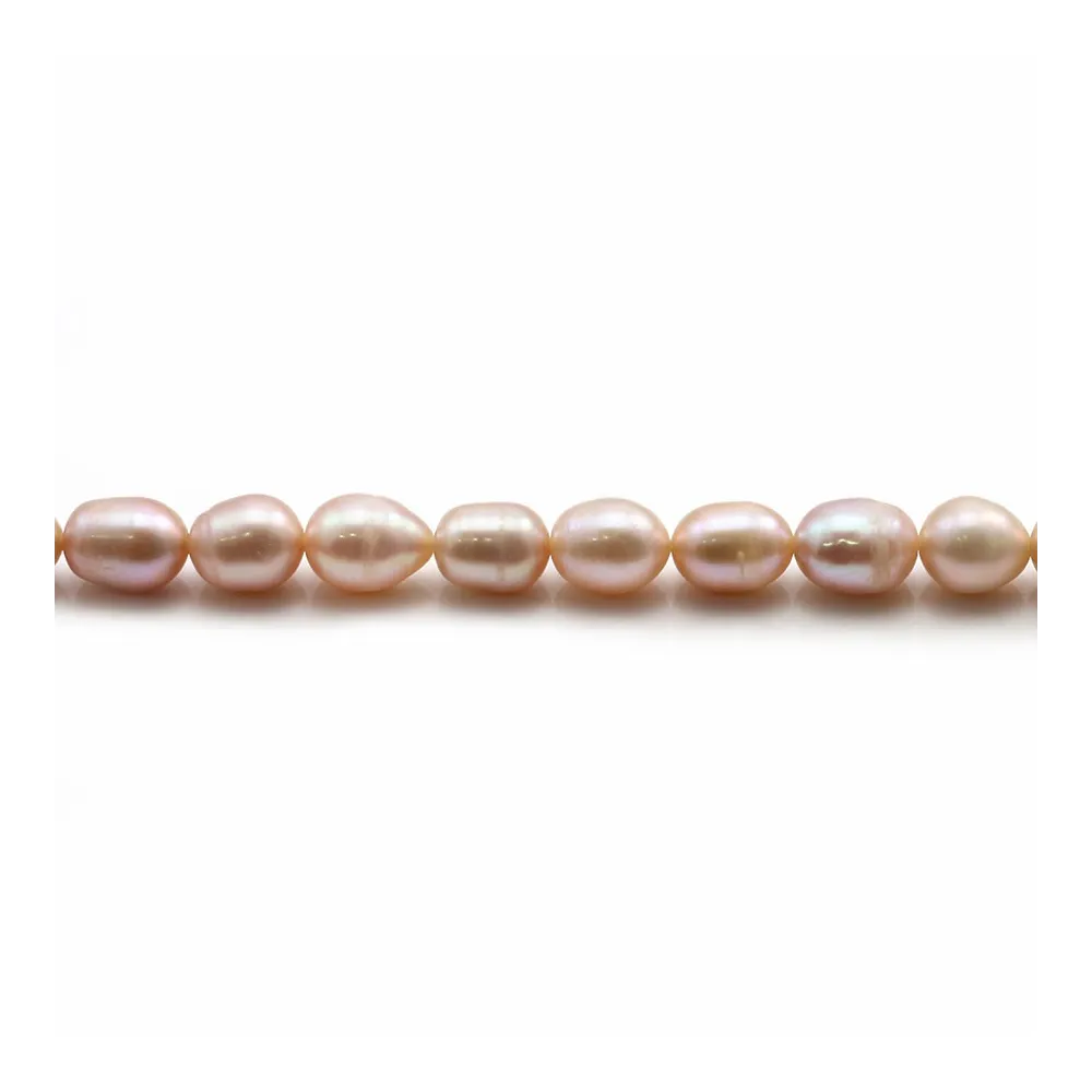 Perles d'eau douce ovales rosé sur fil 6-7mm x 40cm