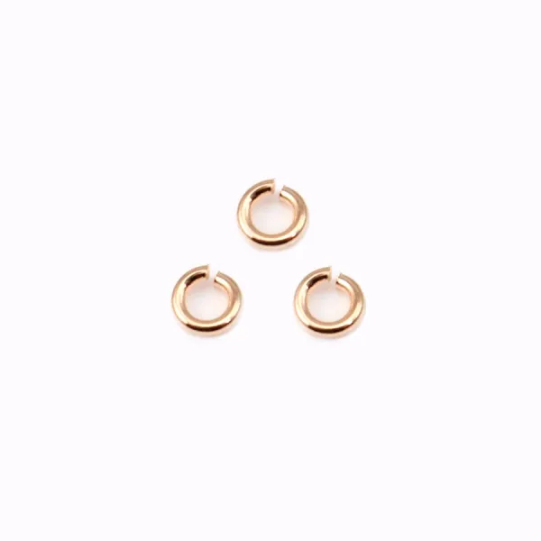Anneaux ouverts plaqués par "flash" or rosé sur laiton 0.55x3mm x 50g