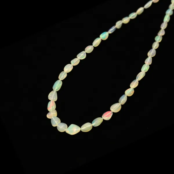 Ópalo etíope oval barroco - lechoso x 50cm