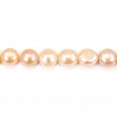Salmon color oval freshwater pearls on thread 13-15mm x 40cm