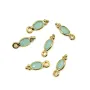 Pingente de Calcedônia oval facetada, engastada em prata 925 dourada a ouro fino, 4x11mm x 1 unidade.