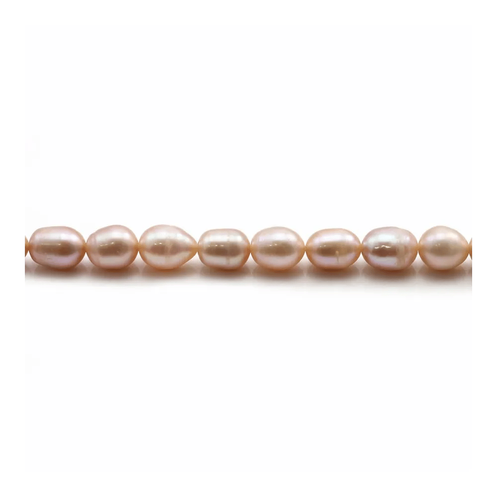Perles d'eau douce ovales rosé sur fil 6-7mm x 40cm