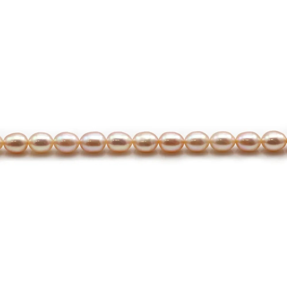 Freshwater pearls colored salmon, in oval shaped, 6 - 7mm x 6pcs
