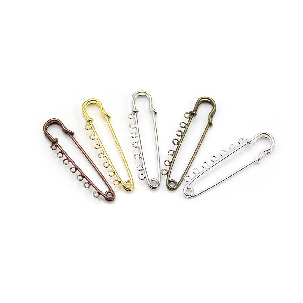 Brooch in metal, in diferent colors, with 7 rings, 58mm * 13 - 15mm x 1pc