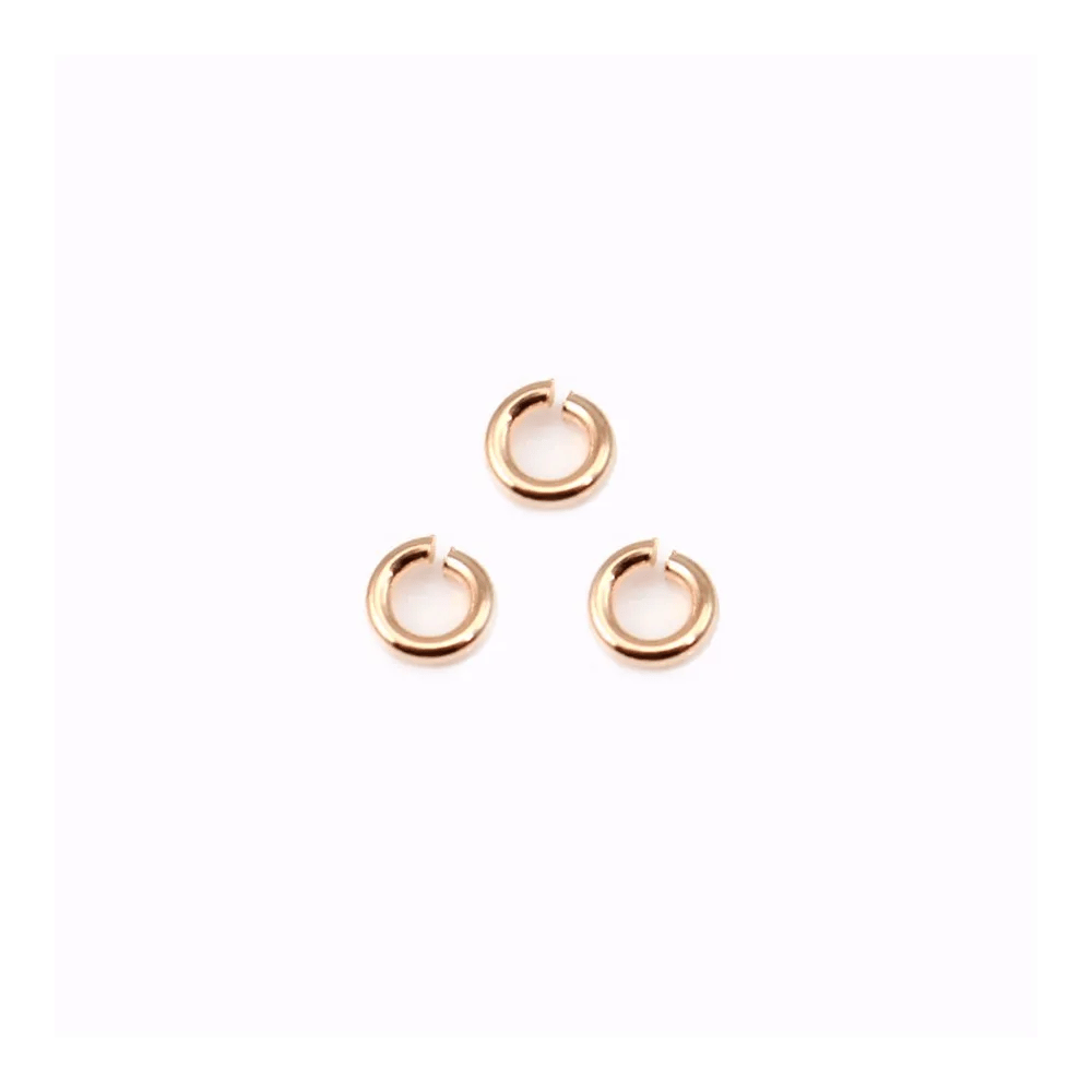 Anneaux ouverts plaqués par "flash" or rosé sur laiton 0.55x3mm x 50g