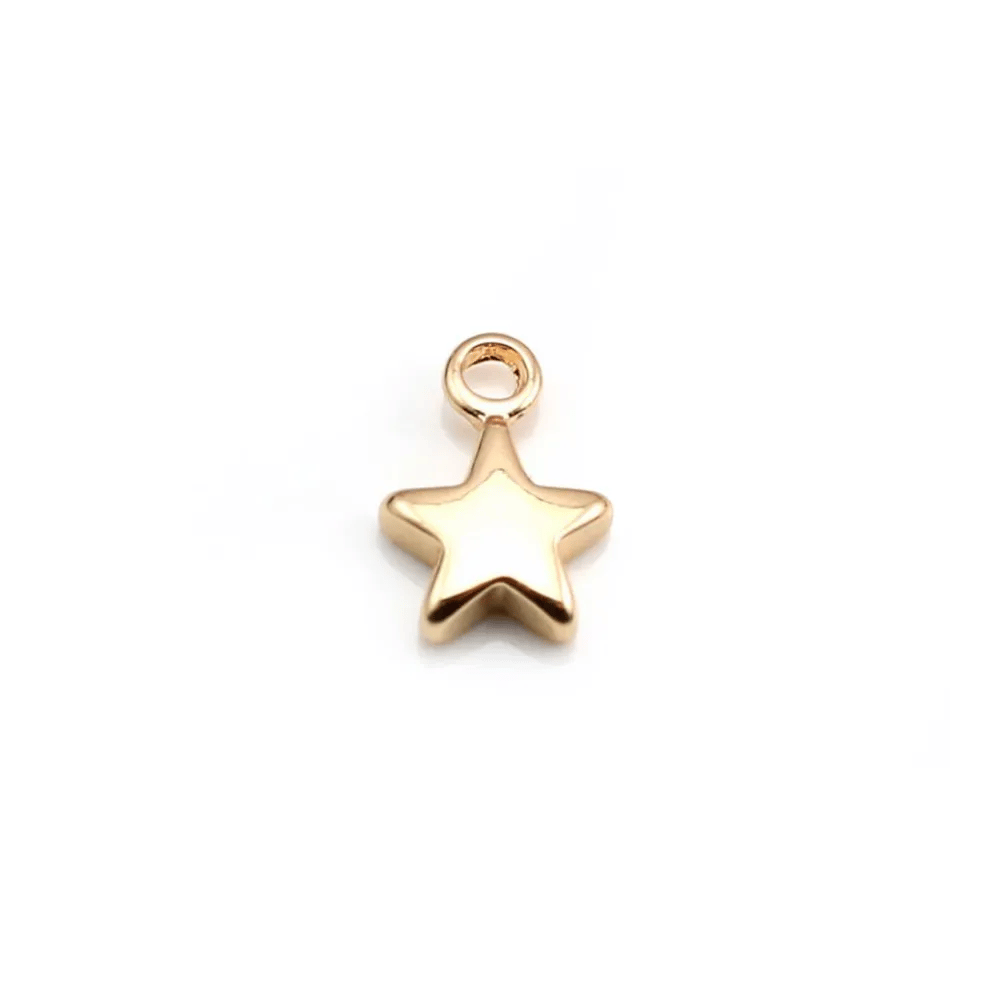 Breloque étoile par "flash" or sur laiton 7x10mm x 10pcs