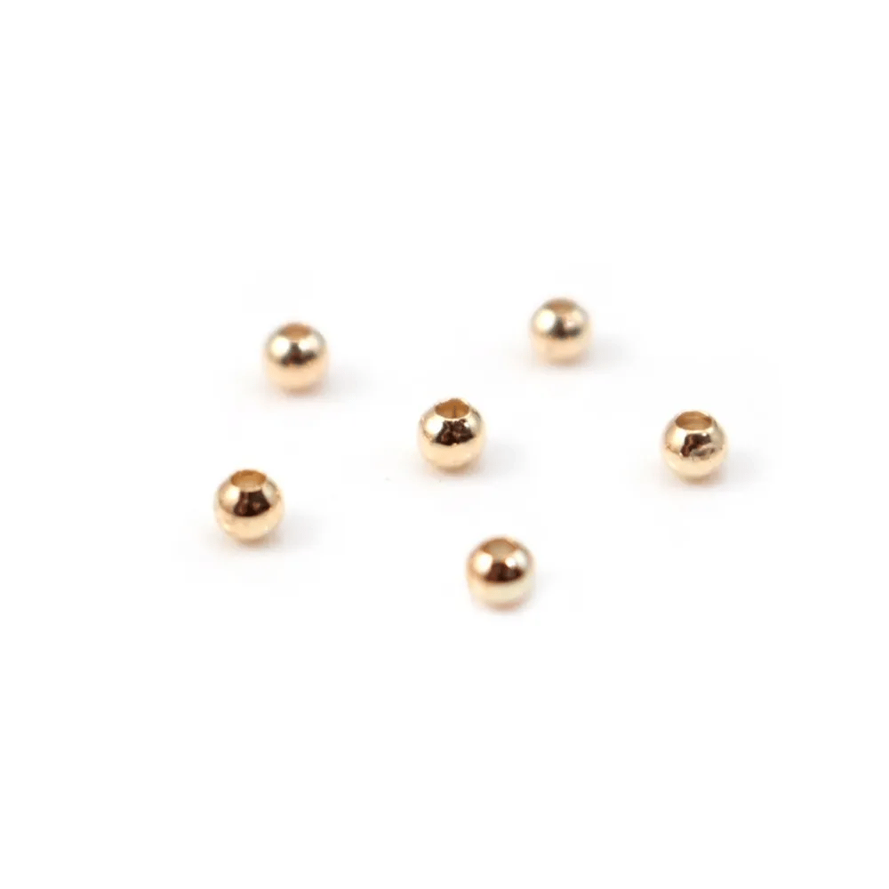 Boule dorée sur laiton 1.2x3mm x 20pcs