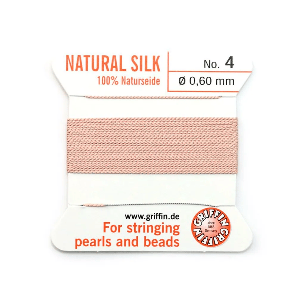 Fil de soie 0.6mm attaché à une aiguille rose pâle  x 2m