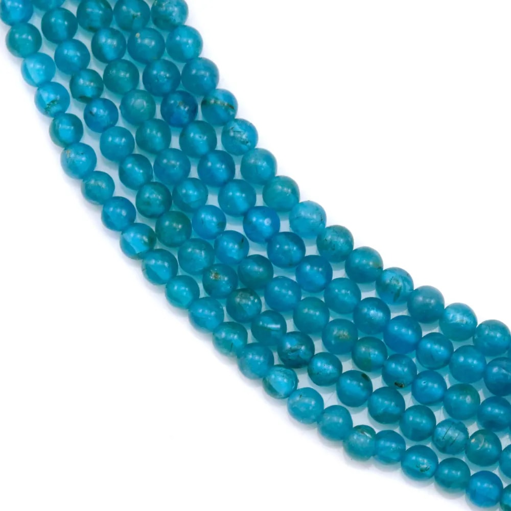 Apatite de couleur bleu et de forme ronde, mesurant 2-2.5mm x 40cm