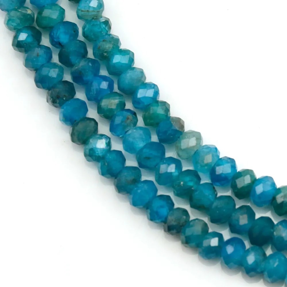 Apatite in blue color, in shape of a faceted roundel, 3 * 4mm x 39cm