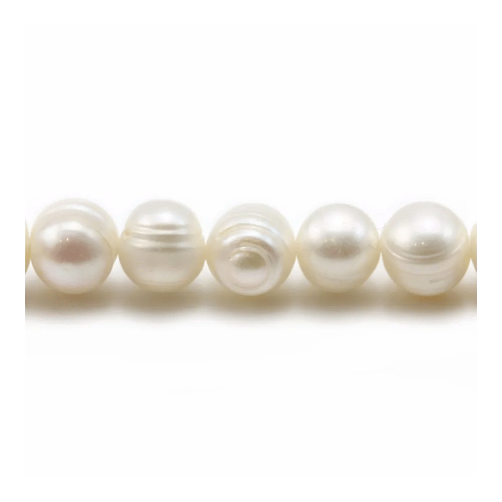 White oval freshwater pearls on thread 7-8mm x 40cm