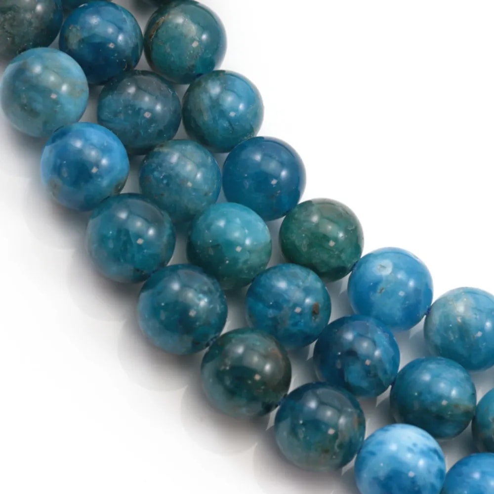 Apatite sous forme de perle ronde 6mm sur fil.