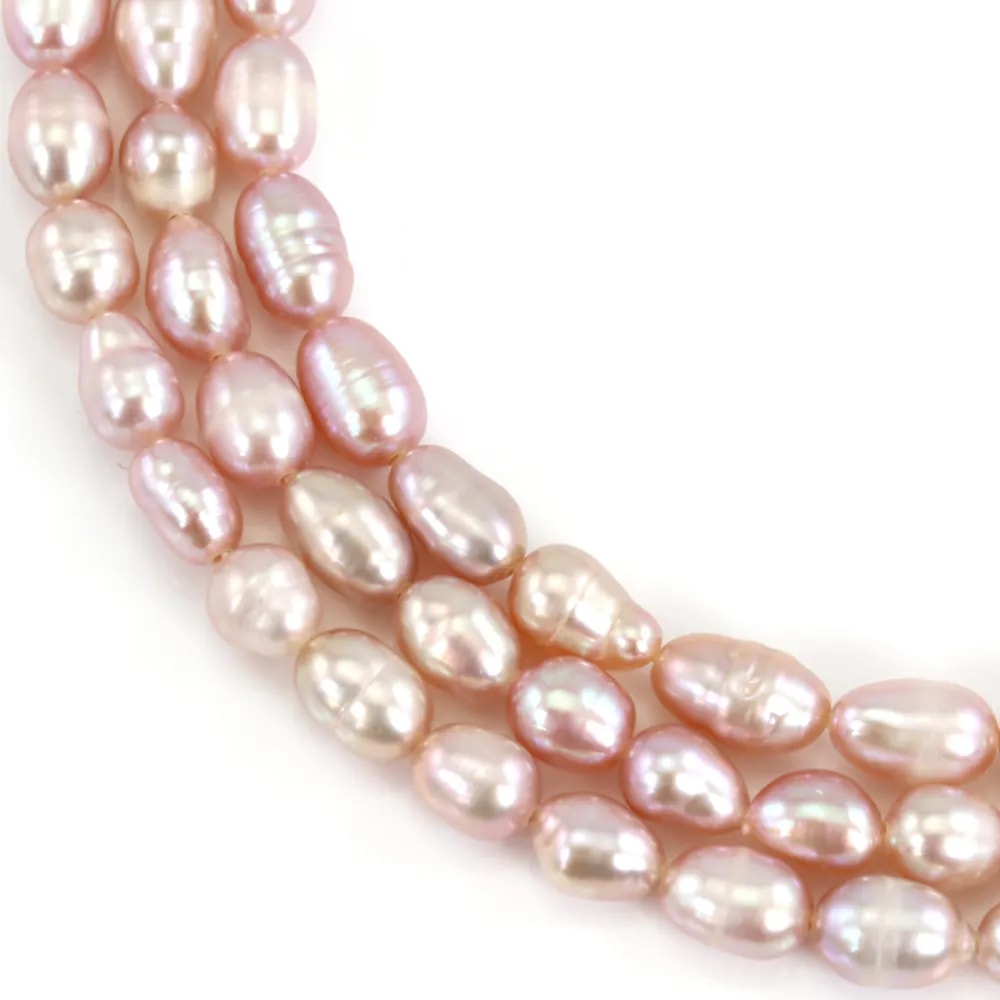 Mauve oval freshwater cultured pearls on thread 4-5mm x 36cm