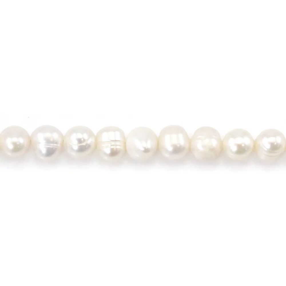 White freshwater cultured pearls oval/irregular 6-6.5mm x 35cm