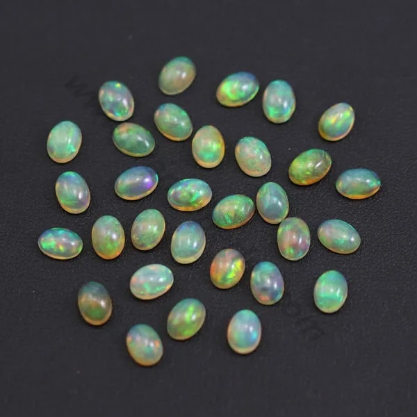 Ethiopian opal in cabochon, multicolored, in oval shape, 5 * 7mm x 1pc