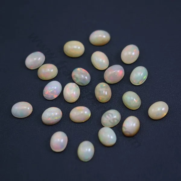 Ethiopian opal in cabochon, multicolored, in oval shape 7 * 9mm x 1pc