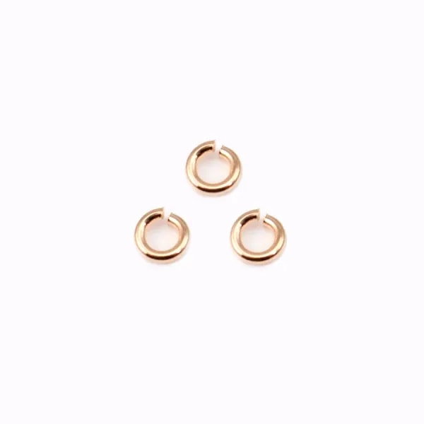 Anneaux ouverts plaqués par "flash" or rosé sur laiton 0.55x3mm x 50g