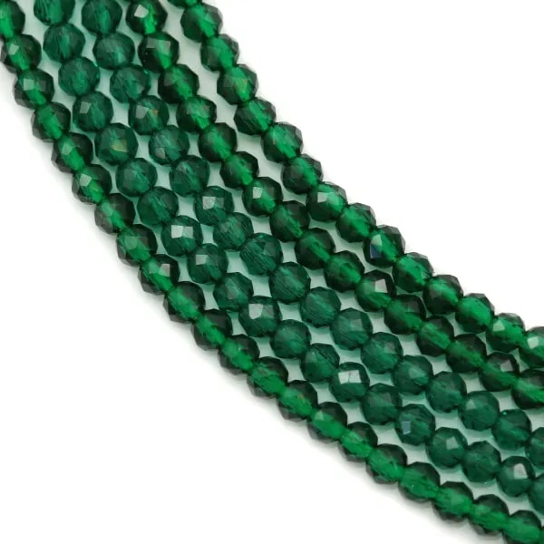 Emeraude synthétique verte, de forme ronde facetté, mesurant 2mm x 40cm