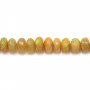 Opal, in the shape of a faceted roundel, graded in size x 40cm